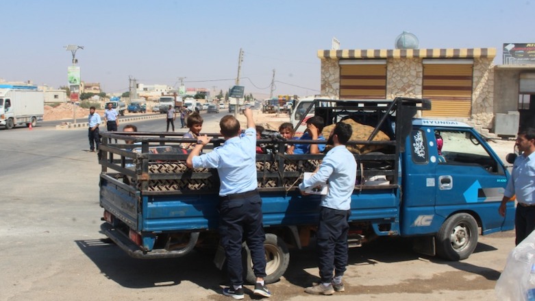 Idlib Police share water with the community on a very hot Wednesday afternoon.
