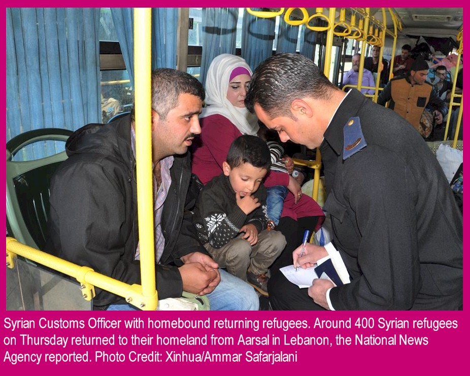 Syrian Customs Officer with homebound returning refugees. Around 400 Syrian refugees on Thursday returned to their homeland from Aarsal in Lebanon, the National News Agency reported. Photo Credit: Xinhua/Ammar Safarjalani